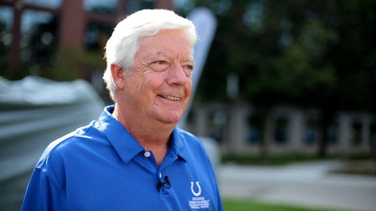 Indiana Farm Bureau Insurance's CEO Joe Martin sitting and smiling into the distance