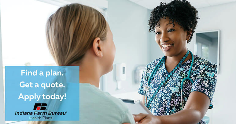 Female doctor helping female patient in a doctor's office