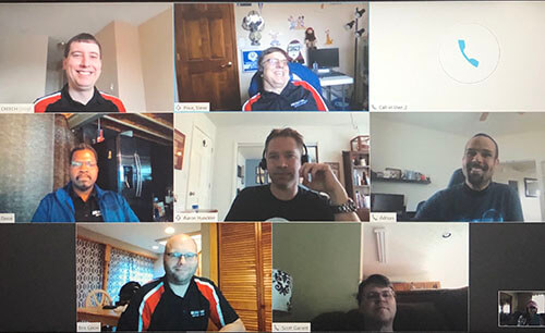 Server Support Team Meeting on Zoom with multiple employees in their employee shirts