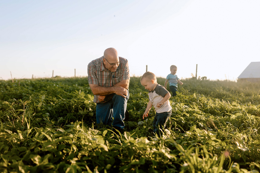 Farmer with child in the field