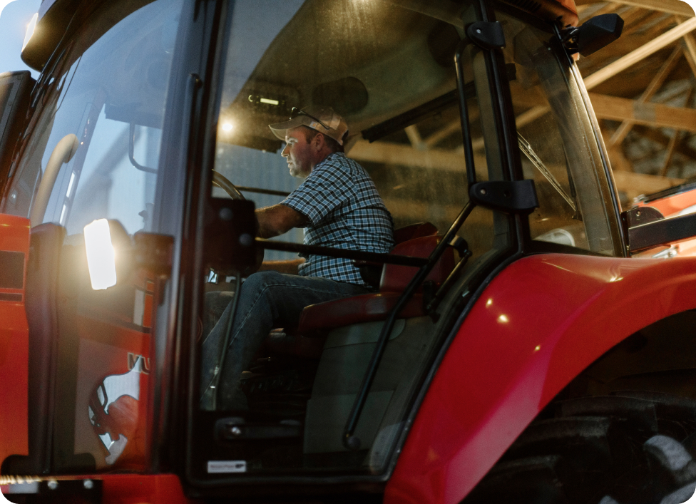 Farmer driving tractor