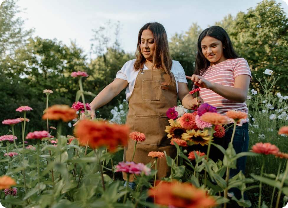 Mother and daughter in flower field