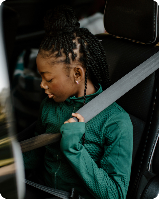 teenage girl bucking seat belt